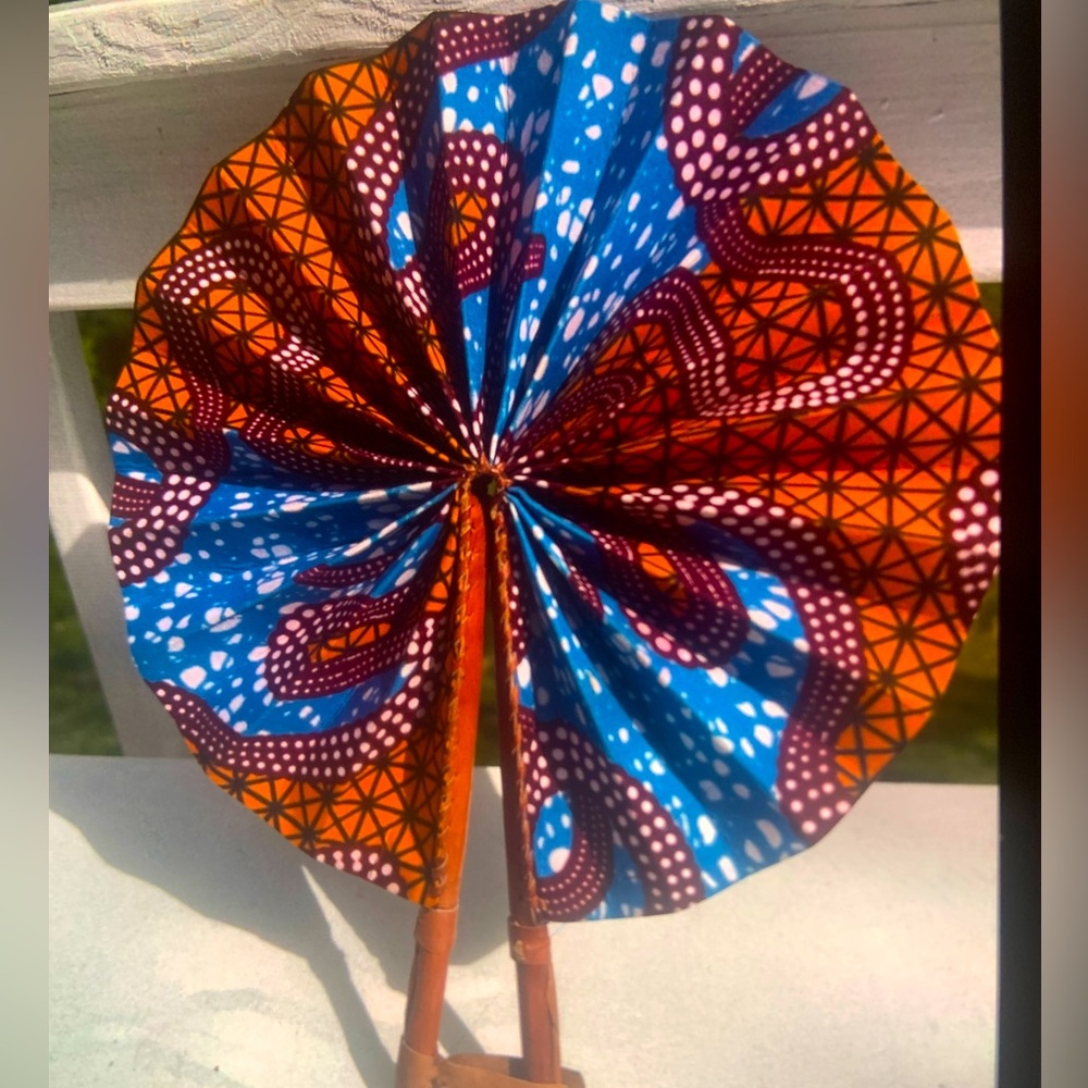 fan made out of leather trimmings and African fabric.